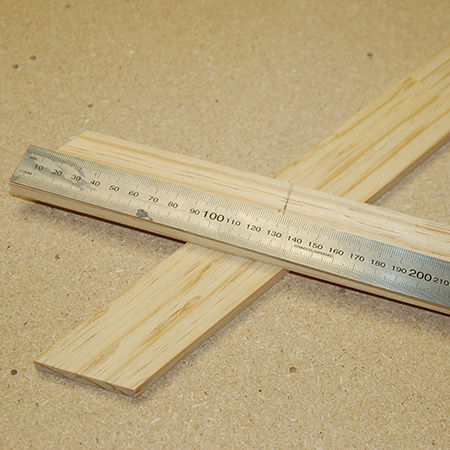 2. On all legs (top and bottom) measure down 130mm and mark the centre (22mm). This will determine where to drill the holes for the dowel and the string line. 