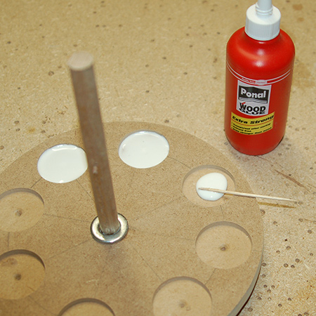 Once set, turn over and apply glue to around the base of the dowel.