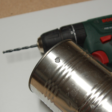 Coffee cans become an attractive plant holder