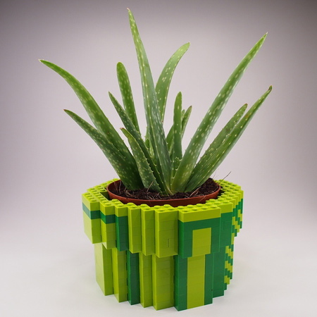 What about a funky plant holder? Shape lego blocks to fit around a plant pot for a fun arrangement.