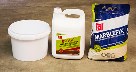 Install glass mosaics on shower floor