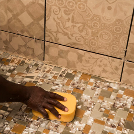 Install glass mosaics on shower floor