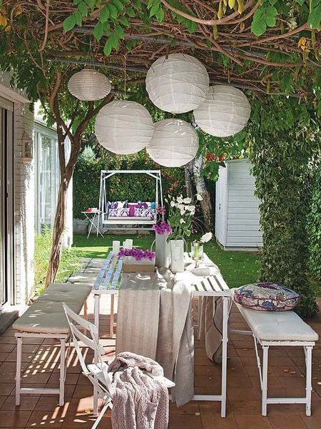 add outdoor lighting with LED fairy lights and chinese paper lanterns