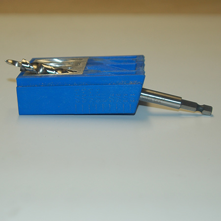 The jig is designed in such a way as to allow angled holes to be drilled into timber or board, while the unique drill tip bores out a pilot hole for the screw.