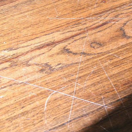 When laminate flooring is used in areas where there is high traffic, such as an entrace or hallway, the plastic laminate wears away and the decorative paper with it.