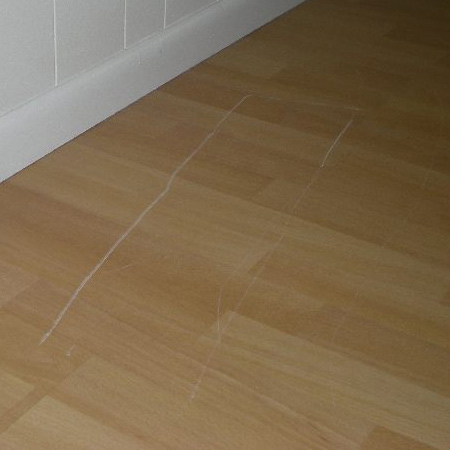 While a certain amount of touch ups can be done when scratches initially occur, these are generally of a temporary nature and have to be done repeatedly to keep the laminate floor looking good. You can buy touch up crayons that fill and cover up scratches, and it is important to ensure that the floor is cleaned regularly to prevent dust and debris from scratching the floor. 