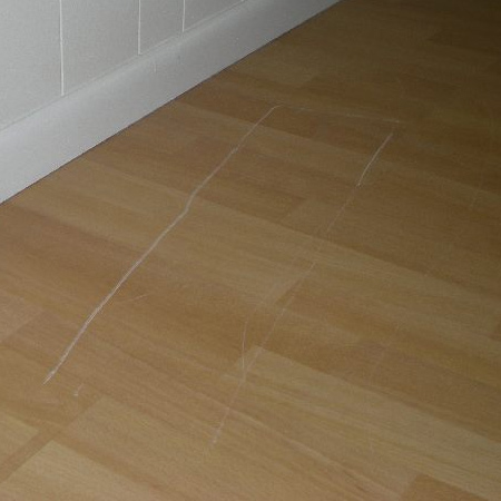 While a certain amount of touch ups can be done when scratches initially occur, these are generally of a temporary nature and have to be done repeatedly to keep the laminate floor looking good. You can buy touch up crayons that fill and cover up scratches, and it is important to ensure that the floor is cleaned regularly to prevent dust and debris from scratching the floor.