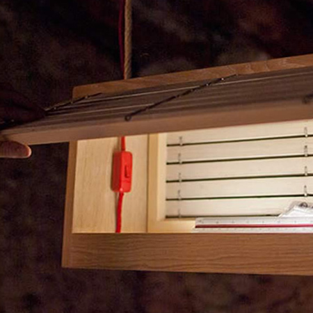 A basic rectangular box is crafted from wood and an inexpensive tube CFL light mounted inside. A light switch located on the inside of the box for switching the light on and off is accessed via a hinged panel at the back of the box. So easy, so simple, so practical.