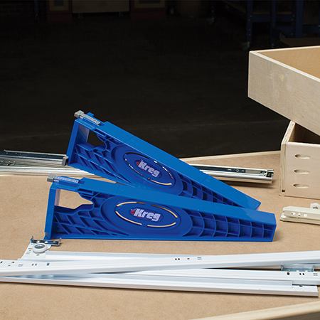 The Kreg Drawer Slide Jig simplifies drawer installation by aligning slides in the cabinet and on the drawer.
