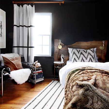 Enhance a modern bedroom with a rustic headboard made using reclaimed wood planks