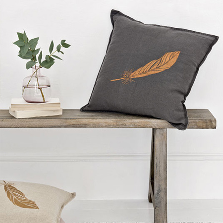 Add metallic detail to plain cushions. Choose and design for your cushions and cut out an acetate or plastic sheet stencil.