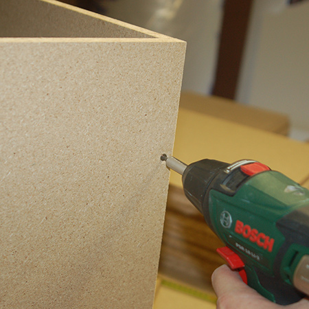 Upholstered ottoman assembly