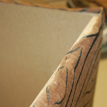 Upholstered ottoman staple fabric