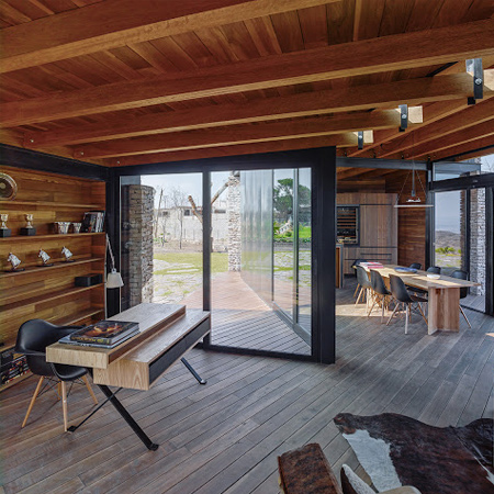 timber wood home has timber roof beams and wood floors