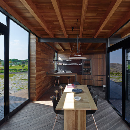 timber wood home with timber roof beams and wood floor