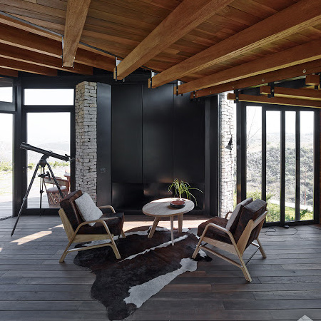 timber wood home with timber roof beams and wood floors