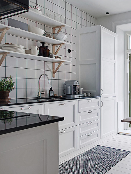 bring in a colourful rug that ties in with colourful accessories in the kitchen