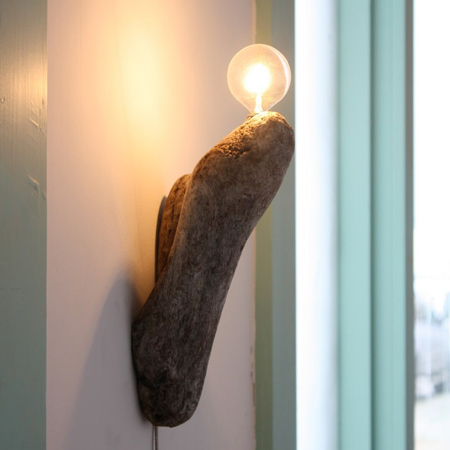 A beautiful piece of driftwood is turned into a dramatic wood wall light