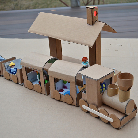 Smaller cardboard boxes can be recycled into so many wonderful play ideas. I love this choo-choo train with all its accessories, made from assorted cardboard items.