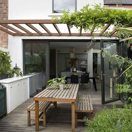 Where an outdoor courtyard opens up to interior spaces, try to link these areas as much as possible to make the best possible use of both areas. Extending a kitchen or dining room into a courtyard increases your living spaces and allows for year-round entertainment areas.