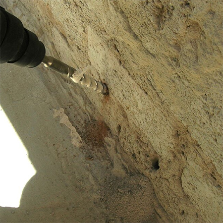 2. For a plaster wall use an angle grinder and diamond blade to cut back to the brick. For proper application any covering should be removed down to the brick.