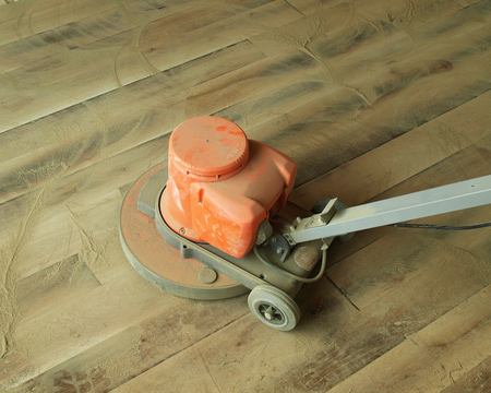 The ideal method is to use a floor sanding machine. These can be hired by the day and are relatively easy to use
