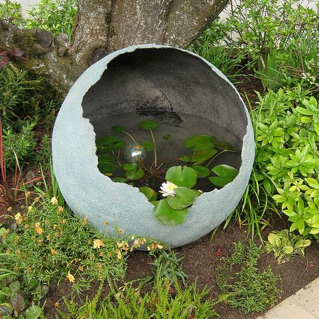 Spray the inside of your concrete sphere with Rust-Oleum LeakSeal and fill with water for a pretty water feature.