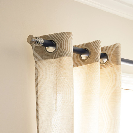 Here's how to make an inexpensive curtain rail using cabinet knobs and a pine dowel