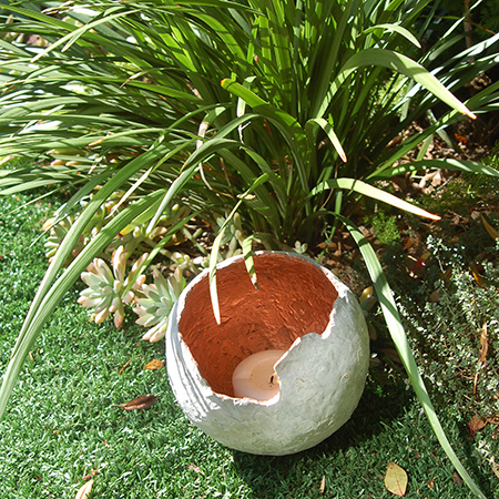 The inside of the concrete sphere was sprayed with Rust-Oleum copper metallic spray paint.