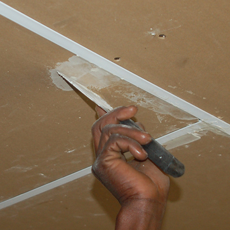 After fitting all the ceiling boards in place the holes can be filled with a read-mixed flexible crack filler. This type of filler is less susceptible to cracking and falling out later on.  