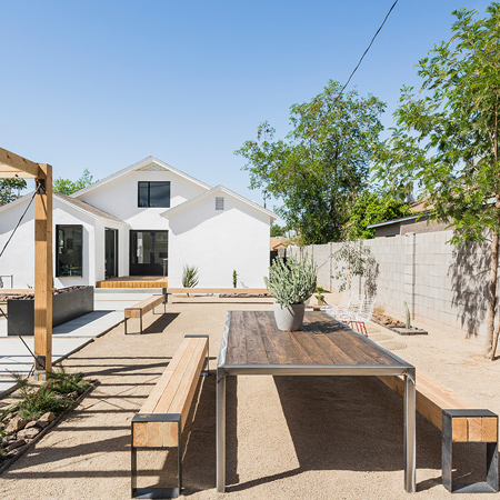 Wood decking mirrors the timber pergola