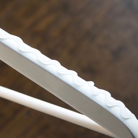 Add dabs of hot glue to coat hangers to prevent clothes from slipping off