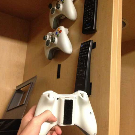 Use velcro strips to organise toys and games