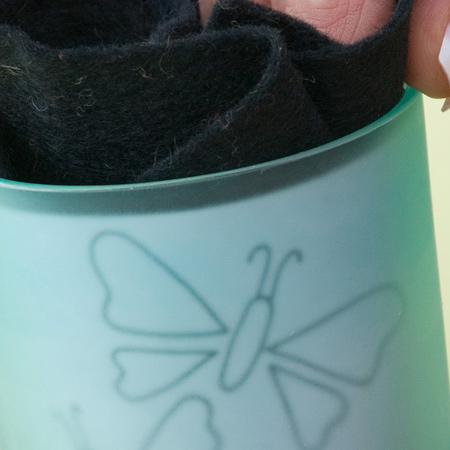 Seaglass votive with engraved butterfly design