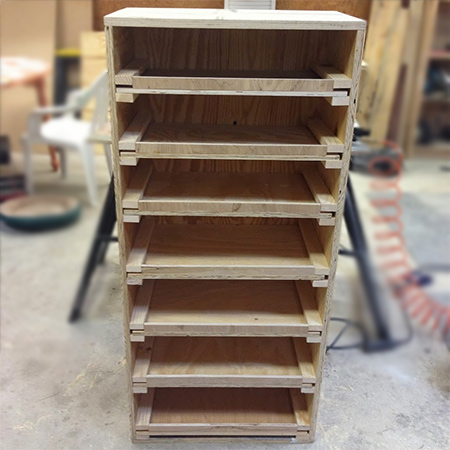 Add some hooks to the side of the cabinet for hanging paintbrushes and paint rollers.