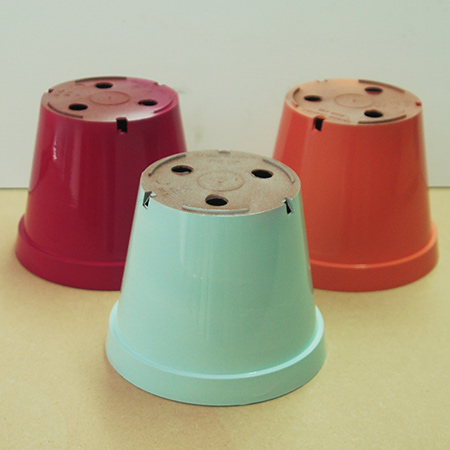 Shake the can well and then spray all the pots