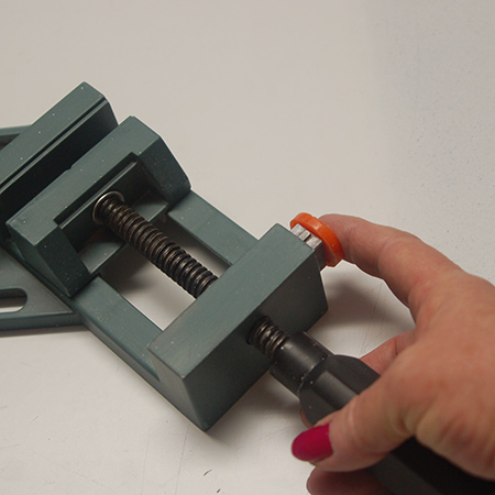 the Tork Craft adjustable clamp has a quick-release button that, when pressed, allows you to easily remove your project and open the clamp faces