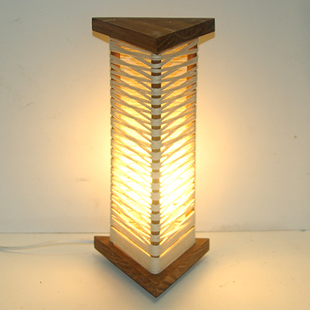 This wood and string lamp is fun to make, and you can arrange the string into so many different variations for a lamp that is truly unique.