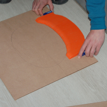 Fit the Tile Profile around the curves to be cut and then transfer this onto a piece of cardboard. 