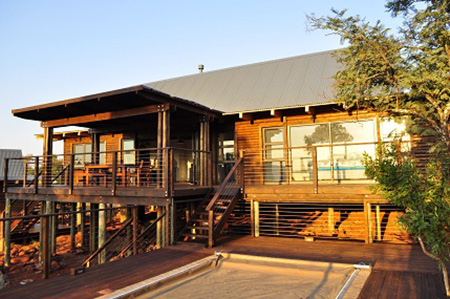 Off-grid log home for Nylstroom mountain estate