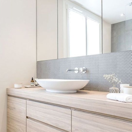 HOME-DZINE | Bathroom Ideas - Splurge on an elegant and stylish backsplash by only tiling essential areas. Today's bathrooms don't need to be tiled from top to bottom. If you're renovating or updating and existing bathroom, leave off the tiles and invest in glass mosaic tiles for around basins and baths.