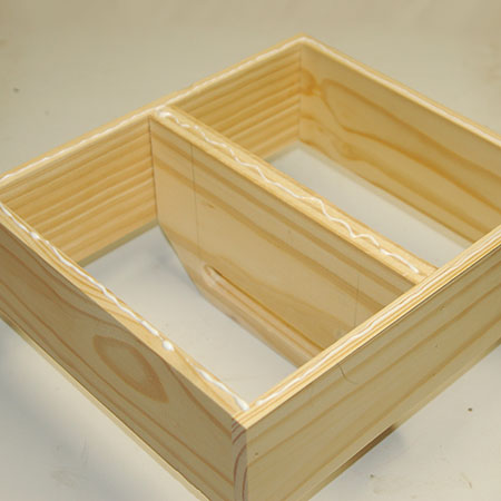 8. Place a bead of wood glue around the edges before securing the base onto the frame with your pneumatic nailer - or hammer and panel pins.