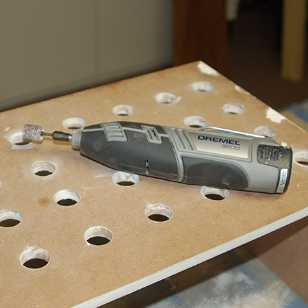 4. If you own a Dremel MultiTool, a sanding ring is perfect for sanding inside the cut holes. Alternatively, sand the wood filler with 120- and then 240-grit sandpaper.