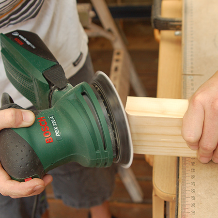 1. Use a sander to round off the edges that will form the top and base of the pedestal. Sand away any rough edges on all pieces.