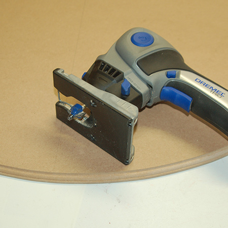 10. Use a router to add a decorative edge to the larger circular piece and sand the edges of both pieces smooth.