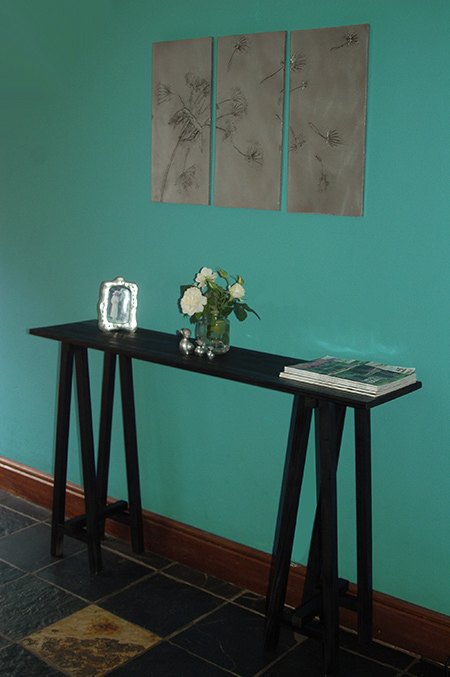 Use laminated pine shelving and pine planks to make a Trestle Console Table in a jiffy that will cost around R300!