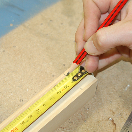 2. On both top crosspieces, measure 20mm in from the edges and mark all round. This will be a guide for attaching the legs.