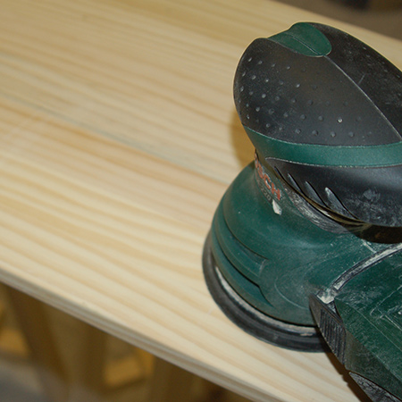 6. Drive a screw through the top of the legs into the top crosspiece, and where the legs and sides are glued together.