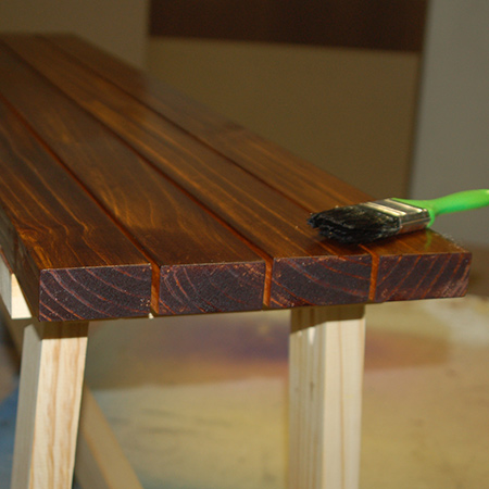 After applying the gel stain, three coats of Woodoc 5 polywax sealer were applied to the seat slats.