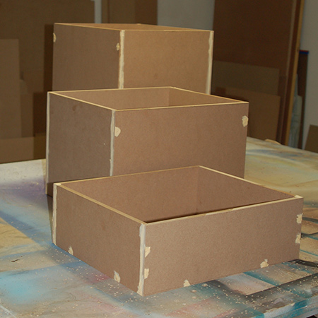 Once assembled, all holes are filled in with alcolin wood filler before sanding smooth. Wipe away all dust.